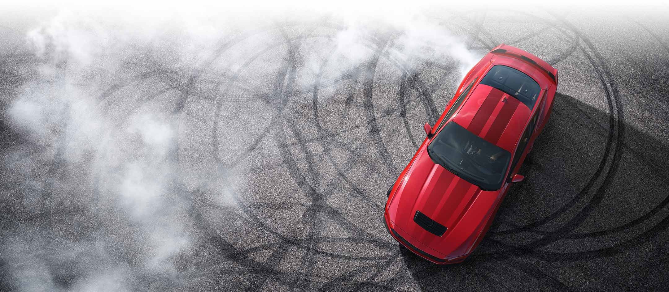 Overhead view of a 2024 Ford Mustang® model with tire tracks on pavement | Big Valley Ford, Inc. in Ewen MI