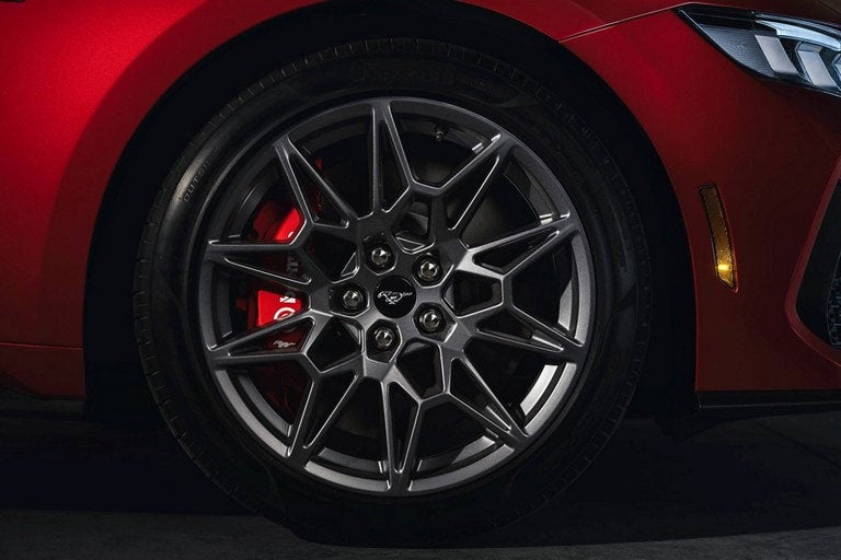 2024 Ford Mustang® model with a close-up of a wheel and brake caliper | Big Valley Ford, Inc. in Ewen MI